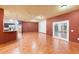 Spacious open-concept living and kitchen area, with ceramic tile flooring and a french door entrance at 3403 Great Pond Dr, Kissimmee, FL 34746