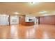Open-concept living room featuring terracotta tile flooring and neutral wall colors at 3403 Great Pond Dr, Kissimmee, FL 34746