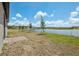 Expansive backyard with a serene pond view, perfect for relaxation and outdoor enjoyment at 4006 Copperleaf Ln, Poinciana, FL 34759