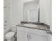 Bathroom featuring a white vanity, granite countertop, and shower-tub combo at 4006 Copperleaf Ln, Poinciana, FL 34759