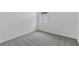 Carpeted bedroom featuring a window and neutral paint at 4006 Copperleaf Ln, Poinciana, FL 34759