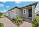 Attractive single-story home with paver driveway, green lawn, and appealing landscaping at 4006 Copperleaf Ln, Poinciana, FL 34759