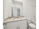 Bathroom with granite counter, vanity and tub at 4010 Copperleaf Ln, Poinciana, FL 34759