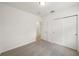 Bedroom with carpet and an open closet at 4010 Copperleaf Ln, Poinciana, FL 34759