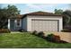 Charming single-story home with a two-car garage and well-manicured lawn at 4010 Copperleaf Ln, Poinciana, FL 34759
