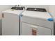 Laundry room with white, front load washer and dryer at 4010 Copperleaf Ln, Poinciana, FL 34759