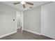 This bedroom features a ceiling fan, closet, and doorway to the en-suite bathroom at 4127 Sanseviera Ln, Orlando, FL 32822