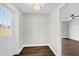 Inviting hallway with hardwood flooring, connecting living spaces with natural light at 4127 Sanseviera Ln, Orlando, FL 32822