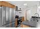 Modern kitchen with stainless steel appliances, wooden cabinets, and subway tile backsplash at 4127 Sanseviera Ln, Orlando, FL 32822