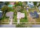 Aerial view of home showcasing landscaping, driveway, lawn, and proximity to neighboring properties at 4442 Glenview Ln, Winter Park, FL 32792