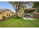 Backyard showing a metal boat carport and storage shed in the background at 4442 Glenview Ln, Winter Park, FL 32792