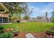 Large, well-maintained backyard with mature trees and lush lawn at 4442 Glenview Ln, Winter Park, FL 32792