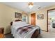 Inviting bedroom with a decorative bed, closet doors and natural light at 4442 Glenview Ln, Winter Park, FL 32792