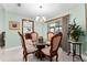 Elegant dining area featuring chandelier and sliding glass door access to the outdoor space at 4442 Glenview Ln, Winter Park, FL 32792