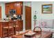 View of the kitchen with stainless appliances and wood cabinets from the living area at 4442 Glenview Ln, Winter Park, FL 32792