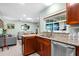 Updated kitchen featuring granite countertops and stainless steel appliances opening up to the living area at 4442 Glenview Ln, Winter Park, FL 32792