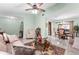 Open concept living room with tile flooring flowing into dining room with sliding glass door at 4442 Glenview Ln, Winter Park, FL 32792