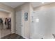 Bathroom showing a walk-in closet and a shower with a white tiled wall at 447 Talisi Loop, St Cloud, FL 34771