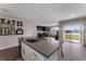 Kitchen island open to the living room featuring lake view and slider door access to lanai at 447 Talisi Loop, St Cloud, FL 34771