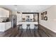 Kitchen featuring stainless steel appliances, island seating, and luxury vinyl plank flooring at 447 Talisi Loop, St Cloud, FL 34771