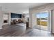 Living room features luxury vinyl plank flooring and sliding glass doors to outdoor patio at 447 Talisi Loop, St Cloud, FL 34771