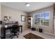 Home office featuring neutral walls, a large window, and a modern desk setup at 447 Talisi Loop, St Cloud, FL 34771