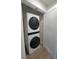 Conveniently located laundry closet with a stacked washer and dryer unit for space-saving efficiency at 5153 Lido, Orlando, FL 32807