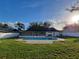 A full length pool is featured in this expansive backyard with a white privacy fence at 5153 Lido, Orlando, FL 32807