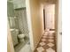 Neutral bathroom featuring sink with vanity, toilet, and shower with patterned shower curtain at 5622 Nokomis Cir, Orlando, FL 32839