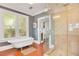 Elegant bathroom features a clawfoot tub and separate glass-enclosed shower at 647 E Livingston St, Orlando, FL 32803