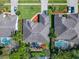 The aerial view highlights the home's layout, including the pool, patio, and surrounding landscape at 712 Timberwilde Ave, Winter Springs, FL 32708