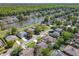 Scenic aerial view of homes near a tranquil river or lake, surrounded by lush greenery at 712 Timberwilde Ave, Winter Springs, FL 32708