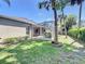 Beautiful backyard featuring a screened-in patio and lush landscaping, creating a private oasis for outdoor enjoyment at 712 Timberwilde Ave, Winter Springs, FL 32708