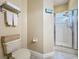 Full bathroom featuring a walk-in shower, toilet, and towel rack at 712 Timberwilde Ave, Winter Springs, FL 32708