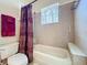 Bathroom with tiled shower/tub and hanging towels at 712 Timberwilde Ave, Winter Springs, FL 32708