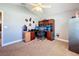 Neutral bedroom featuring a ceiling fan, wall decor, and a built-in wooden shelf and cabinet at 712 Timberwilde Ave, Winter Springs, FL 32708