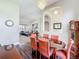 Open-concept dining room featuring hardwood floors, modern chandelier, and neutral walls at 712 Timberwilde Ave, Winter Springs, FL 32708