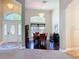 Bright dining area features dark wood floors, high ceilings, and elegant chandelier lighting at 712 Timberwilde Ave, Winter Springs, FL 32708