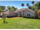 Beautifully landscaped front yard with lush lawn, mature trees, and a well-maintained single-story home at 712 Timberwilde Ave, Winter Springs, FL 32708