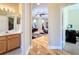 Hallway looking to the Gathering room featuring hardwood flooring and access to the office and bathroom at 712 Timberwilde Ave, Winter Springs, FL 32708