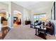 Cozy living room with carpet flooring, comfortable seating, and a glimpse into the kitchen and dining area at 712 Timberwilde Ave, Winter Springs, FL 32708