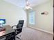 Cozy office space with plush carpet, a ceiling fan, and a view from a window at 712 Timberwilde Ave, Winter Springs, FL 32708