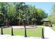 A well-maintained community playground with a covered picnic area, surrounded by green spaces and mature trees at 712 Timberwilde Ave, Winter Springs, FL 32708