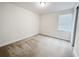 Bedroom with neutral carpet and one window for natural light at 7417 Marker Ave, Kissimmee, FL 34747