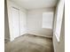 Bedroom with carpet floor, closet, and natural light from a window with blinds at 7417 Marker Ave, Kissimmee, FL 34747