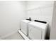 Laundry room with side-by-side washer and dryer and white wire shelf at 7417 Marker Ave, Kissimmee, FL 34747