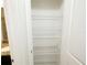 Spacious pantry featuring multiple wire shelves for organized storage at 7417 Marker Ave, Kissimmee, FL 34747