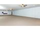 Spacious basement with carpet, bright lighting, and open layout at 7435 Redwing Rd, Groveland, FL 34736