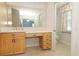 Bathroom has a vanity with drawers and mirror, plus an adjoining toilet room at 7435 Redwing Rd, Groveland, FL 34736