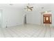 Bright and airy living room features vaulted ceilings and tile floors at 7435 Redwing Rd, Groveland, FL 34736